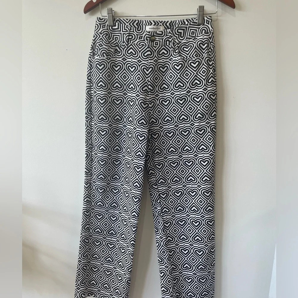 NWOT Another Girl|| Heart Printed straight leg jeansSize 4. Sold on Free people